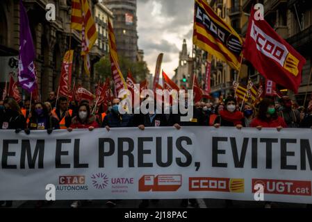 Barcelona, Spain. 23rd Mar, 2022. Unionists with their waving flags march through Barcelona to protest over the price hikes in the fuel and gas sector in conjunction with the Russian attack in Ukraine. Credit: Matthias Oesterle/Alamy Live News Stock Photo