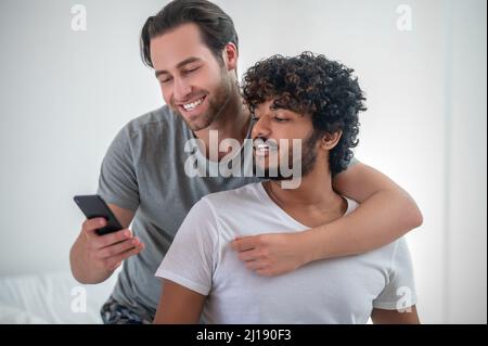 Romantic guy photographing himself and his boyfriend Stock Photo