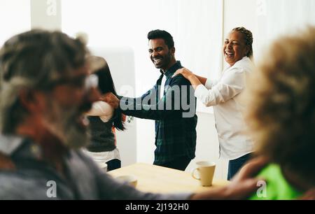 Multiracial happy friends having fun dancing together in the kitchen - Soft focus on Indian man face Stock Photo