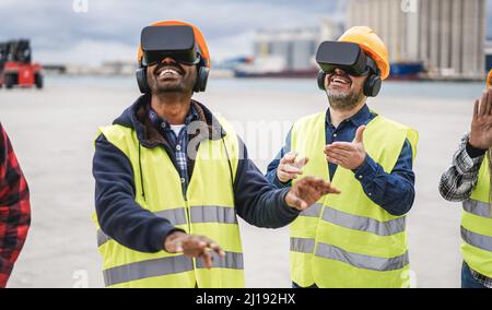Multiracial workers using virtual reality headsets at Freight Terminal Port - Focus on senior man face Stock Photo