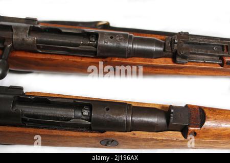 Two Versions of Japanese Arisaka Rifles from WW2. One with Imperial Mum removed and one with intact chrysanthemum Stock Photo