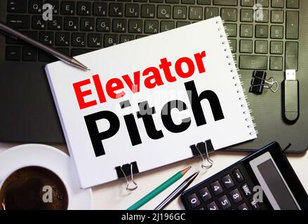 ELEVATOR PITCH, on the tablet pc screen held by businessman hands - online, top view Stock Photo