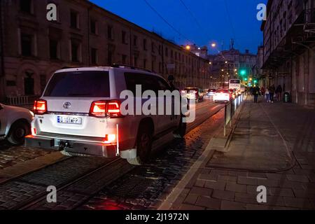 Lviv, Ukraine. 23rd Mar, 2022. A UN SUV drives in traffic at night. (Photo by Ty O'Neil/SOPA Images/Sipa USA) Credit: Sipa USA/Alamy Live News Stock Photo