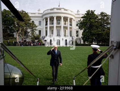 Washington, United States Of America. 23rd Mar, 2022. Washington, United States of America. 23 March, 2022. U.S President Joe Biden salutes as he boards Marine One helicopter to depart from the South Lawn of the White House, March 23, 2022 in Washington, DC Biden is departing on a trip to Brussels and Poland to continue pushing for Ukraine support. Credit: Adam Schultz/White House Photo/Alamy Live News Stock Photo