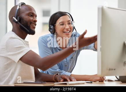 Do you see how confusing that is. Shot of two call center workers together. Stock Photo