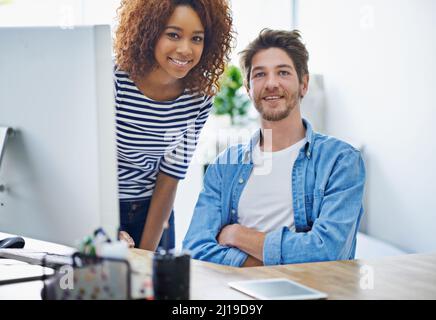 Working together. Cropped shot of two colleagues working in their office. Stock Photo