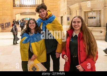 New York, NY - March 23, 2022: Flash mob protest against Russian aggression in Ukraine at Grand Central Terminal Stock Photo