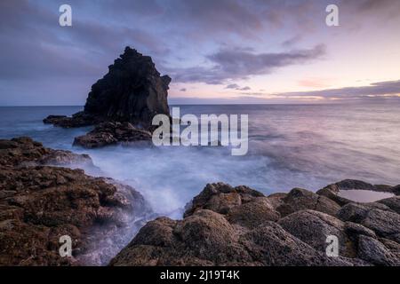 Evening atmosphere on the coast, Ilheu de Santa Catarina, lava rocks in the sea, Madeira, Portugal Stock Photo
