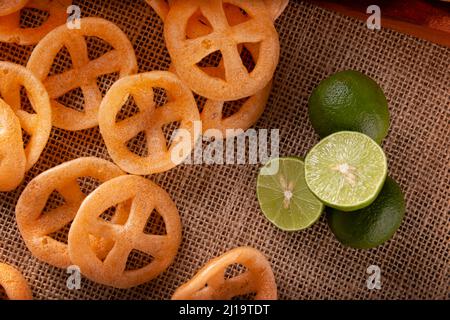 Chicharrones de Harina. Also known as duros, duritos, Mexican wagon wheels or pinwheels, they are a very popular snack made from flour, commonly accom Stock Photo