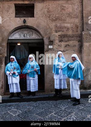 Members of a brotherhood during Good Friday in the streets of Enna, Sicily, Italy Stock Photo