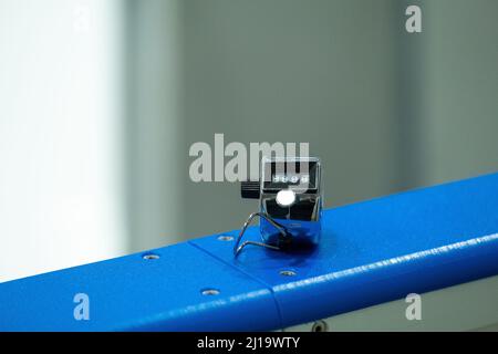 Closeup of a metallic click counter used by ice hockey officials to count shots on goal. Sports statistics. Stock Photo