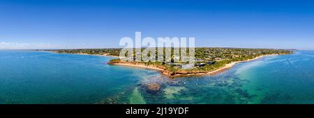 Aerial shot of Daveys Bay Pelican Point, Mount Eliza coastal seascape with turquoise sea and clear blue sky aerial panoramic Stock Photo