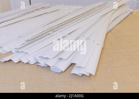 Selective focus shot of some blinds on the table with burlap background Stock Photo