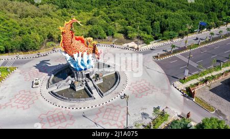 Aerial roundabout with fish statue with barong head in Pelabuhan Benoa harbor in Bali Stock Photo