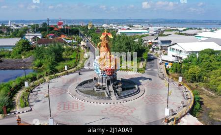 Aerial roundabout with fish statue with barong head in Pelabuhan Benoa harbor in Bali Stock Photo