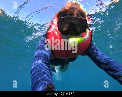 Closeup of senior woman snorkeling in Costa Rica Stock Photo