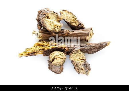 several pieces of chopped dried Liquorice roots on white background Stock Photo