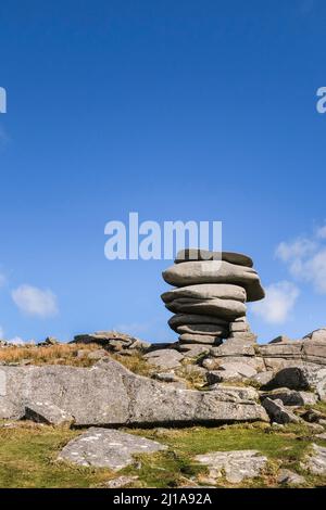 The dramatic stone stack The Cheesewring perched on the side of the rugged Stowes Hill on Bodmin Moor in Cornwall. Stock Photo