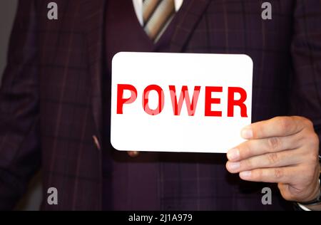 Many Hands Holding the Colorful Word Power, Isolated. Stock Photo
