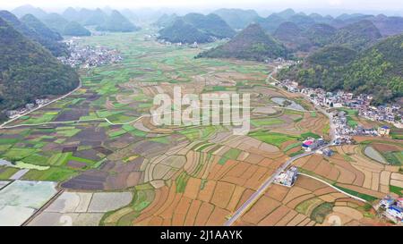 QIANXINAN, CHINA - MARCH 24, 2022 - An aerial photo taken on March 24, 2022 shows farmland crisscrossing in Qianxinan, Guizhou Province, China. Stock Photo