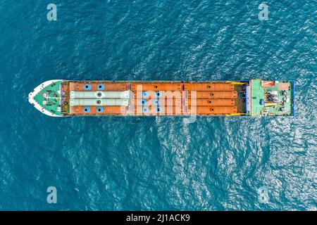 Aerial view of a cargo ship loaded with colorful containers at a ...