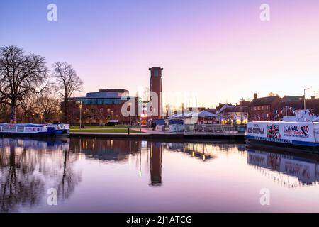 Royal Shakespeare Theatre and Bancroft canal basin on the river avon at sunrise in the winter. Stratford Upon Avon, Warwickshire, England Stock Photo