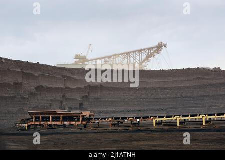 Coal mining in surface mine. Huge bucket excavator during mining. Stock Photo