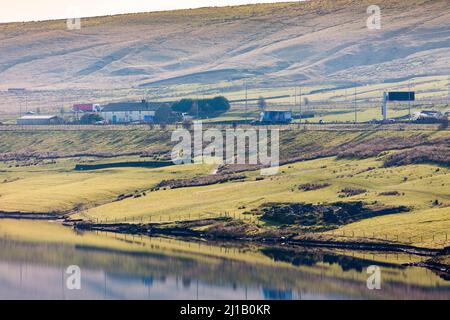 Stott Hall Farm is a farm located between the eastbound and westbound carriageways of the M62 motorway in Calderdale, England. It is the only farm in the UK situated in the middle of a motorway and was built in the 18th century on Moss Moor.  Credit: Windmill Images/Alamy Live News Stock Photo