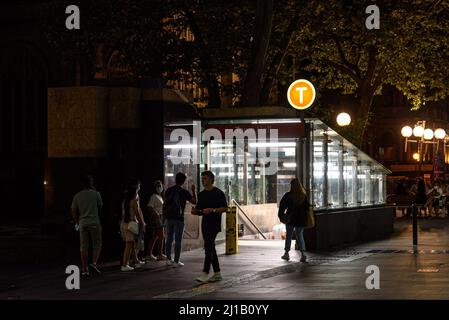 People by the Town Hall station entrance on George Street in Sydney at night Stock Photo