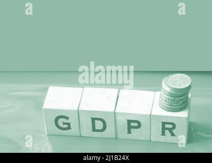 GDPR abbreviation Written In Wooden Cubes on red. Information protection concept. Stock Photo