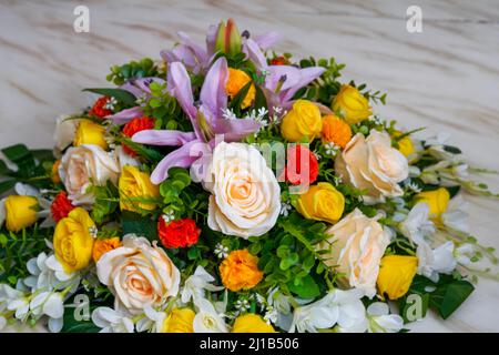 Close-up of a basket of welcome flowers in a hotel box Stock Photo