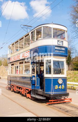 Derbyshire, UK – 5 April 2018: People riding the No.4 Kirkstall Forge vintage blue & cream double decker tram, Crich Tramway Village National Tram Mus Stock Photo