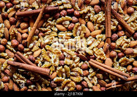 Various nuts, background image, spices, cinnamon, coriander Stock Photo