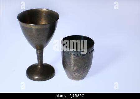 Old metal wine-glasses isolated on white Stock Photo
