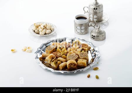 Mix Baklava Dish or Baklawa is Arabic and Turkish Traditional Sweets with Pistachio. Selected Focus Stock Photo
