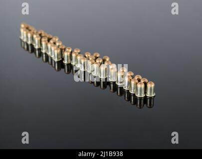 Ammunition .22 BB Cup  Bullet on a mirrored background Stock Photo