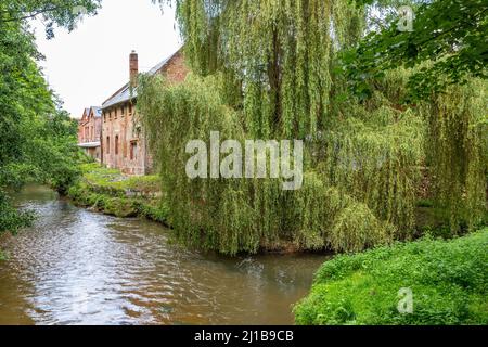 FORMER TEXTILE SPINNING MILL ON THE BANKS OF THE TOUQUES, LISIEUX, CALVADOS, NORMANDY, FRANCE Stock Photo