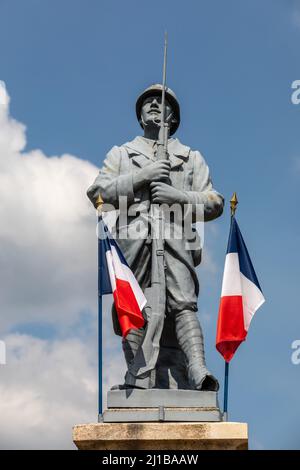 WAR DEAD MONUMENT WITH THE FRENCH FLAG IN HOMAGE TO SOLDIERS OF THE FIRST WORLD WAR,  EURE, FRANCE Stock Photo