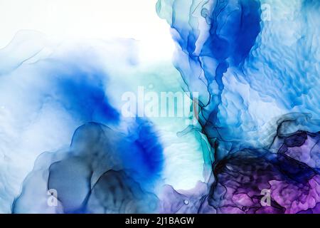 Translucent Alcohol ink on white backdrop. Abstract smudges and stains made with turquoise, blue and purple alcohol ink. Contemporary fluid art. Luxury multicolored pattern. Wrapping paper, wallpaper Stock Photo