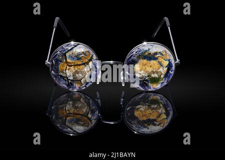 CONCEPTUAL PHOTO SHOWING THE EARTH THROUGH THE LENS OF A PAIR OF GLASSES WITH TWO DIFFERENT VISIONS DEPENDING ON WHAT WE WANT TO SEE, PHOTO EXHIBITION ‘TERRE FRAGILE’ TO RAISE AWARENESS ABOUT HUMANKIND'S IMPACT ON THE PLANET, FRANCE, WORLD Stock Photo