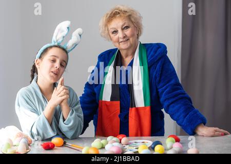 grandmother and granddaughter with uae flag for easter Stock Photo