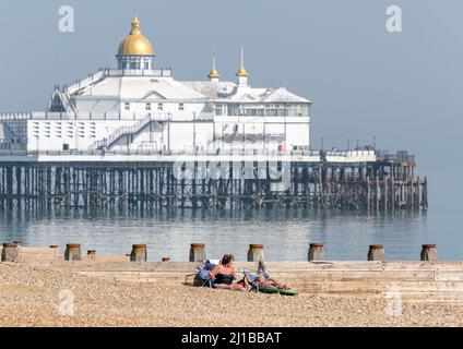 Eastbourne Beach, East Sussex, UK. 24th March, 2022. UK Weather. Sunbathers soak up the sunshine on Eastbourne Beach, East Sussex, UK Credit: reppans/Alamy Live News Stock Photo