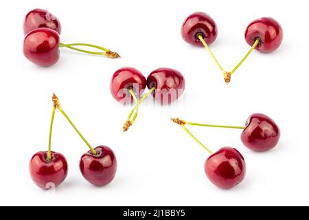 Cherry isolated on white background. Fresh cherries pattern with stems. Cherry set. Stock Photo
