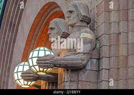 IMPRESSIVE STATUES OF THE TWINS AT THE MAIN TRAIN STATION WITH THE TOWER IN THE BACKGROUND, HELSINKI, FINLAND, EUROPE Stock Photo