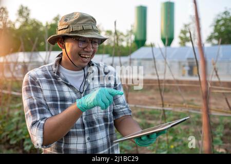 successful smiling of young gardener enjoying with hobby of him Stock Photo