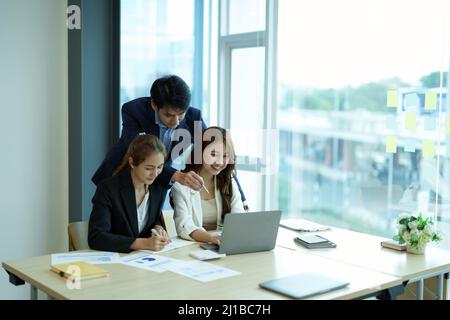 Business people are meeting for analysis data figures to plan business strategies. Business discussing concept Stock Photo