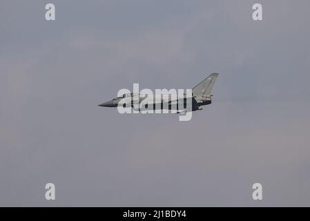 Leeming Bar, UK. 24th Mar, 2022. A RAF Typhoon files over RAF Leeming as part of the 100 Squadron disbandment flyby at RAF Leeming in Leeming Bar, United Kingdom on 3/24/2022. (Photo by Mark Cosgrove/News Images/Sipa USA) Credit: Sipa USA/Alamy Live News Stock Photo