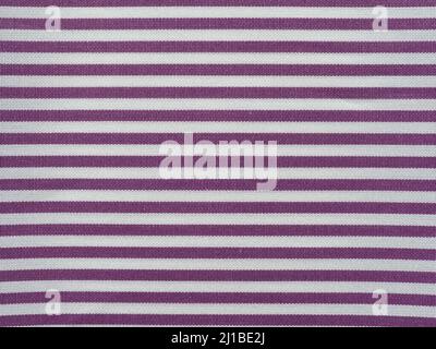 striped purple and white cotton fabric texture useful as a background Stock Photo