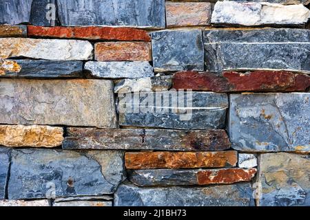 Walls made of multicolor stones , Stone background. Ancient stone wall. Grunge stone wall backdrop. Background of old vintage stone wall. Wall decorat Stock Photo