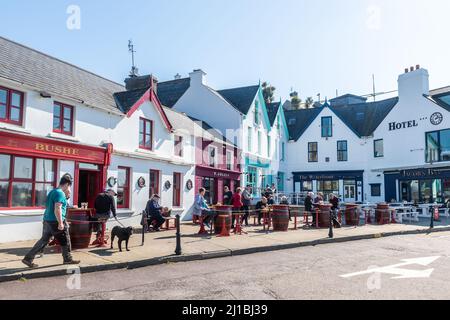 Baltimore, West Cork, Ireland. 24th Mar, 2022. The sun shone in Baltimore today, which brought locals and visitors out to enjoy the warm spring day. Many people enjoyed a drink outside. Credit: AG News/Alamy Live News Stock Photo